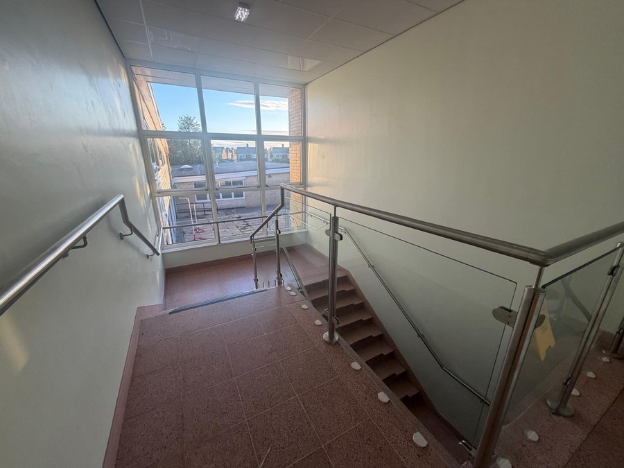 Glass balustrade to the top landing and gallery of a primary school stair core in York